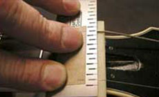 Setting the string spacing